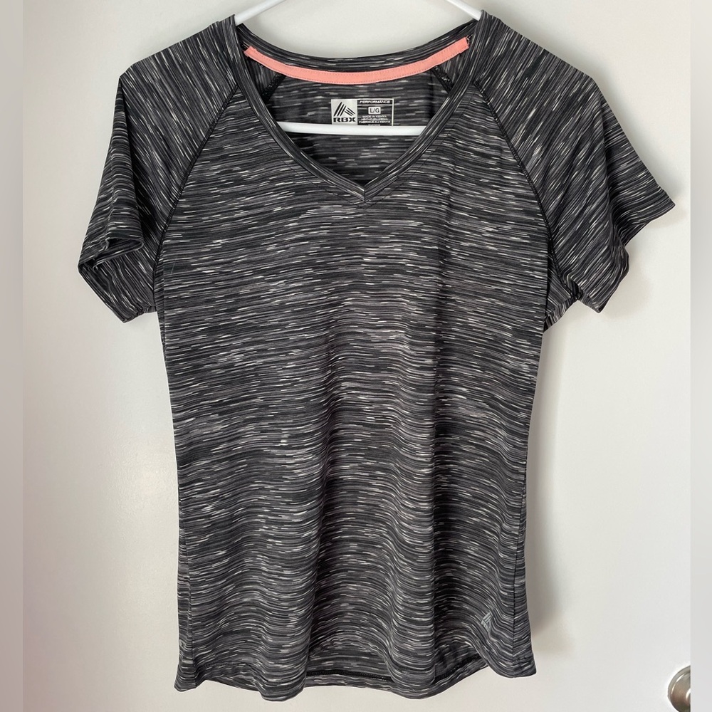 Short sleeved Reebok athletic top. Lightweight and perfect for gym or daily use